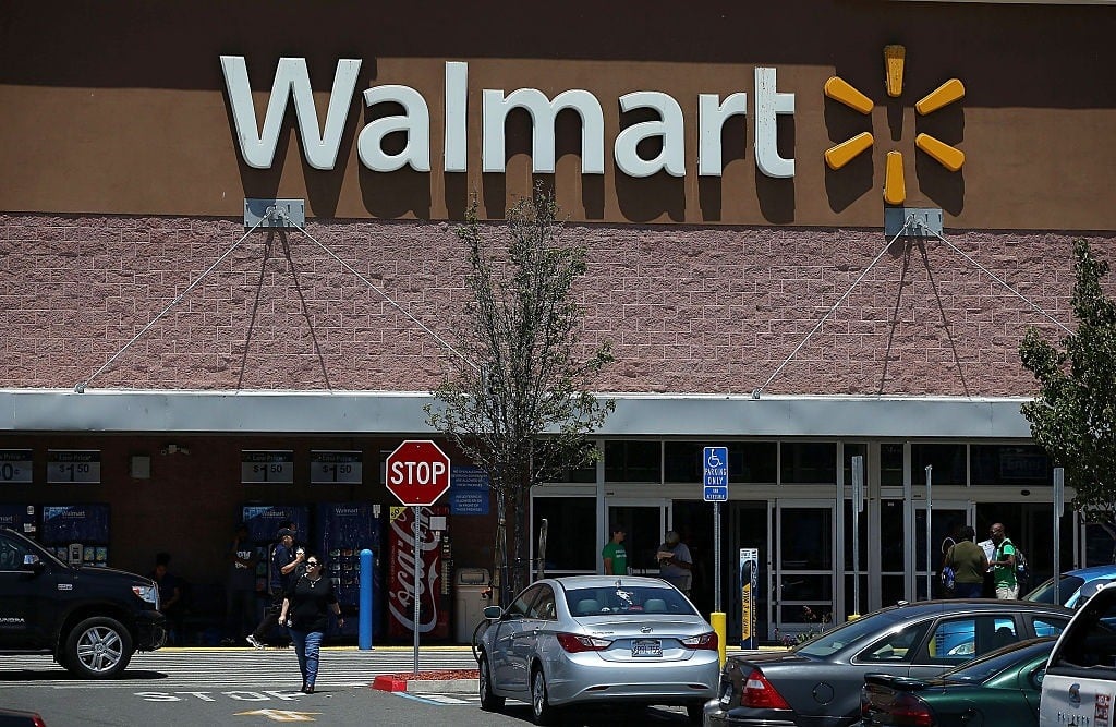 Customers leave a Walmart store