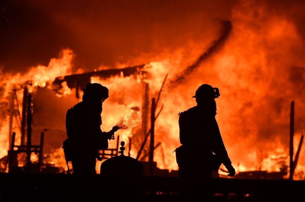 Firefighters douse flames as a home burns in the Napa wine region Firefighters douse flames as a home burns