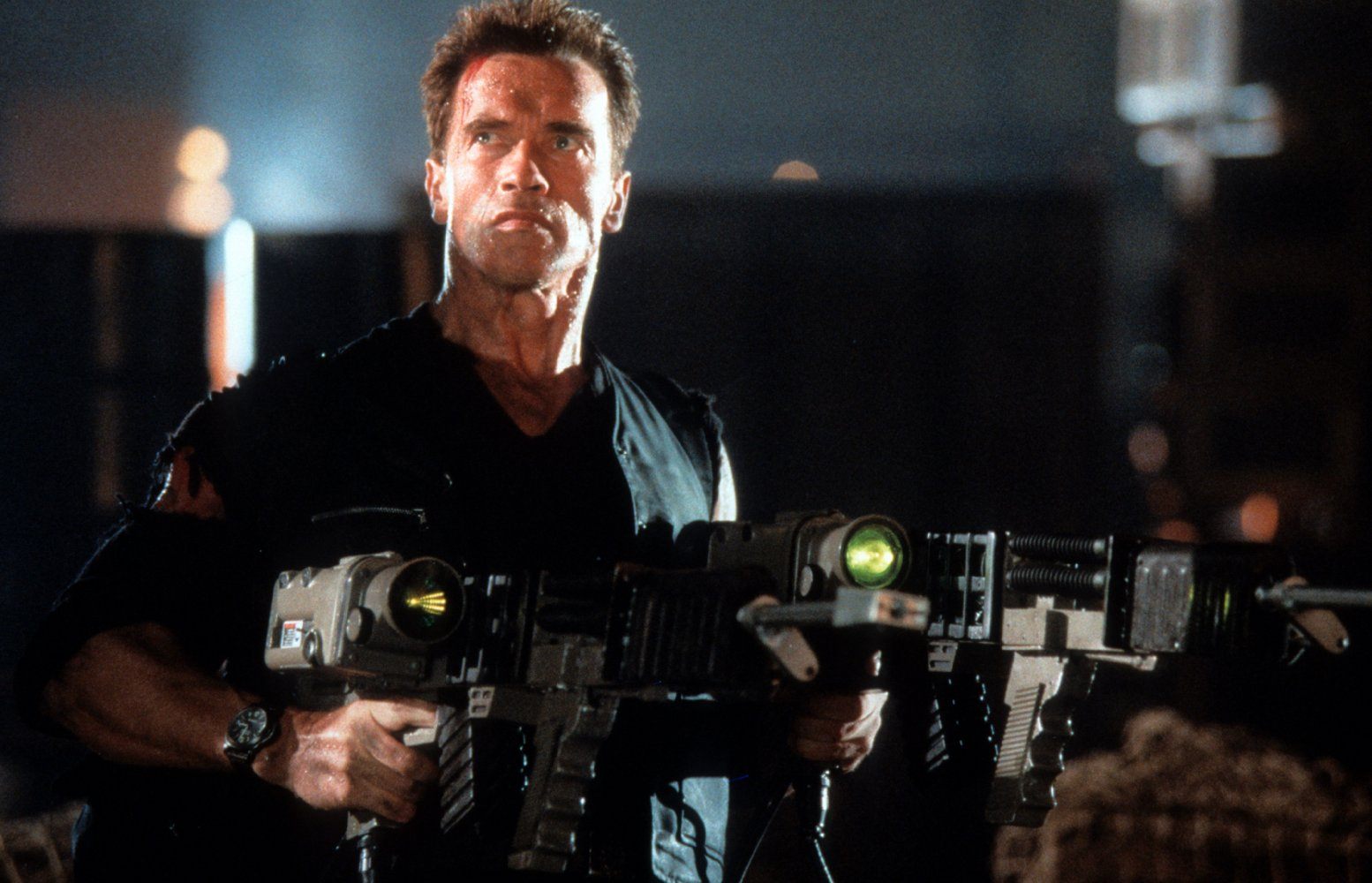 Arnold Schwarzenegger holds a weapon in Eraser