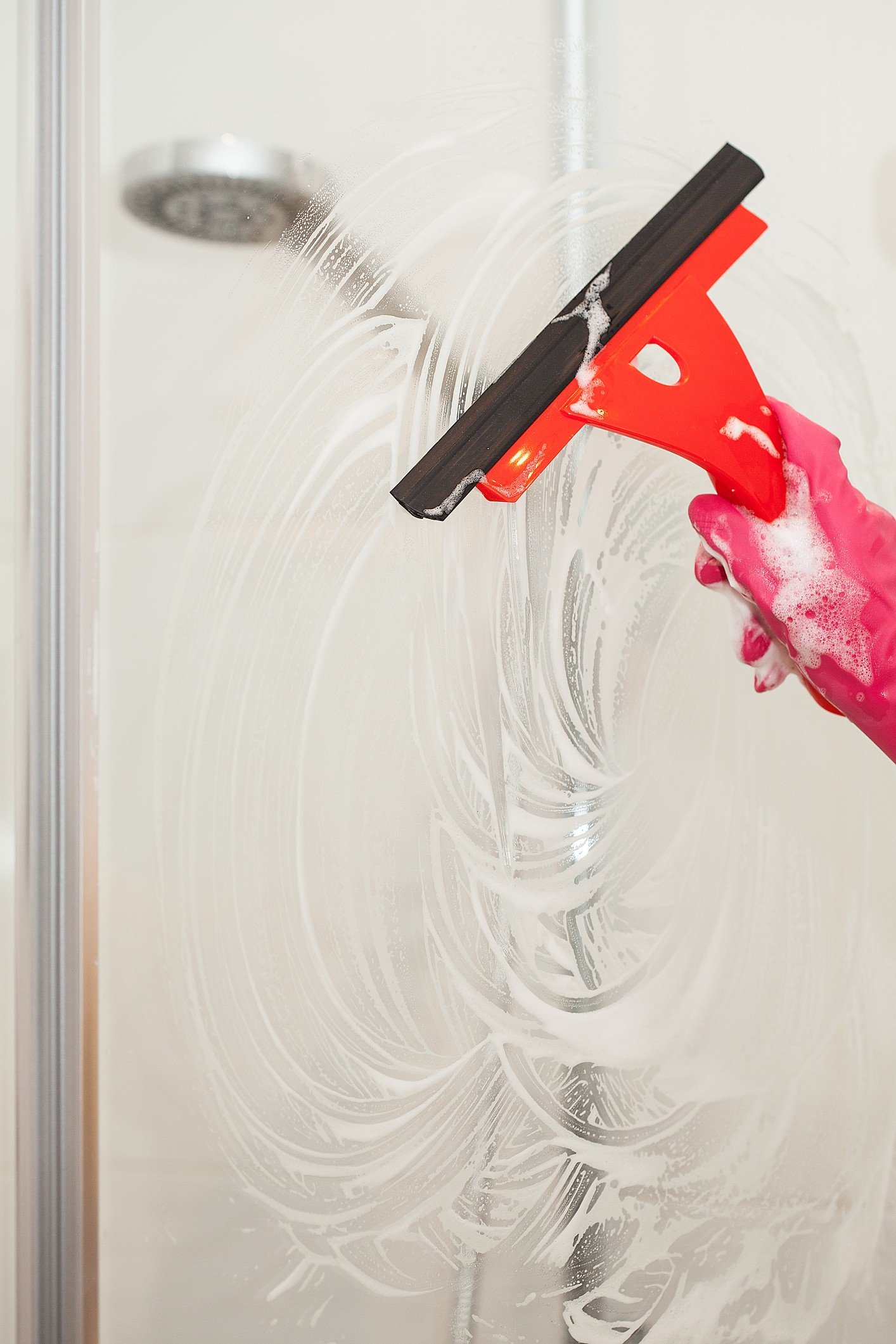 Shower cleaning with squeegee