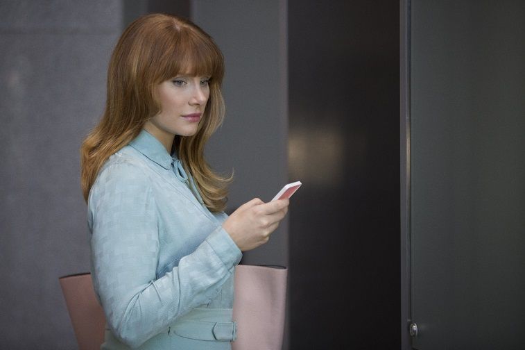 Bryce Dallas Howard holds a phone and wears a blue jacket on Black Mirror