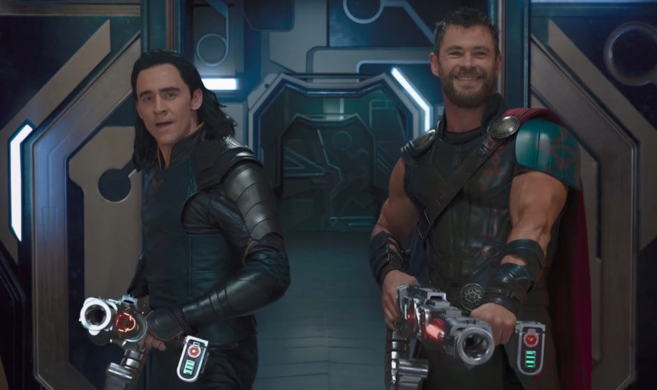 Loki and Thor holding big guns while laughing Loki and Thor holding big guns while laughing