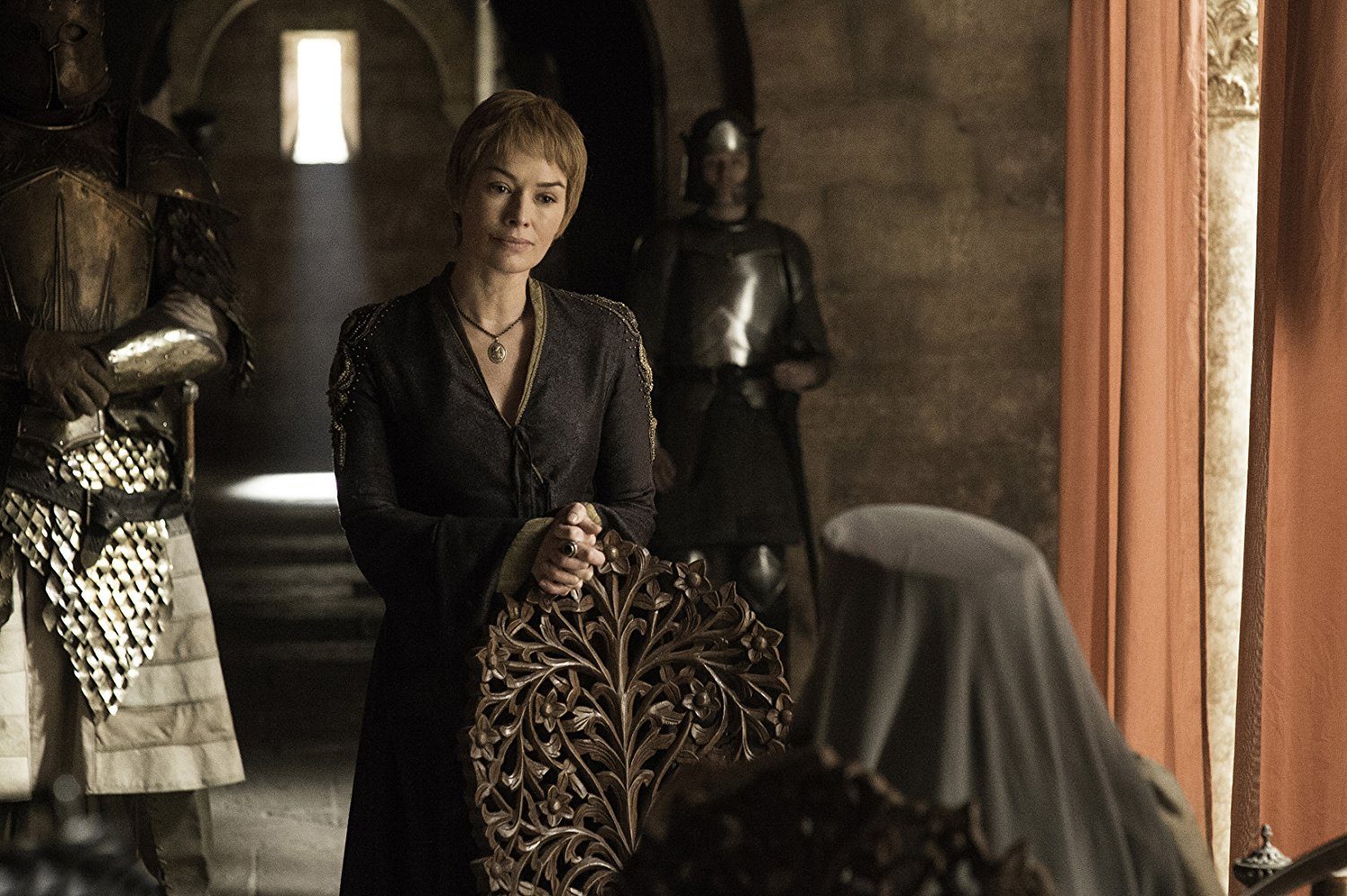 Cersei speaks to someone while standing next to armed guards. Cersei speaks to someone while standing next to armed guards.