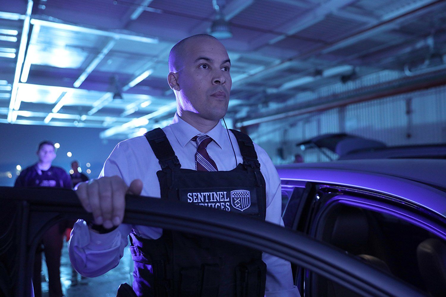 Coby Bell as Jace Turner in a uniform getting out of a car
