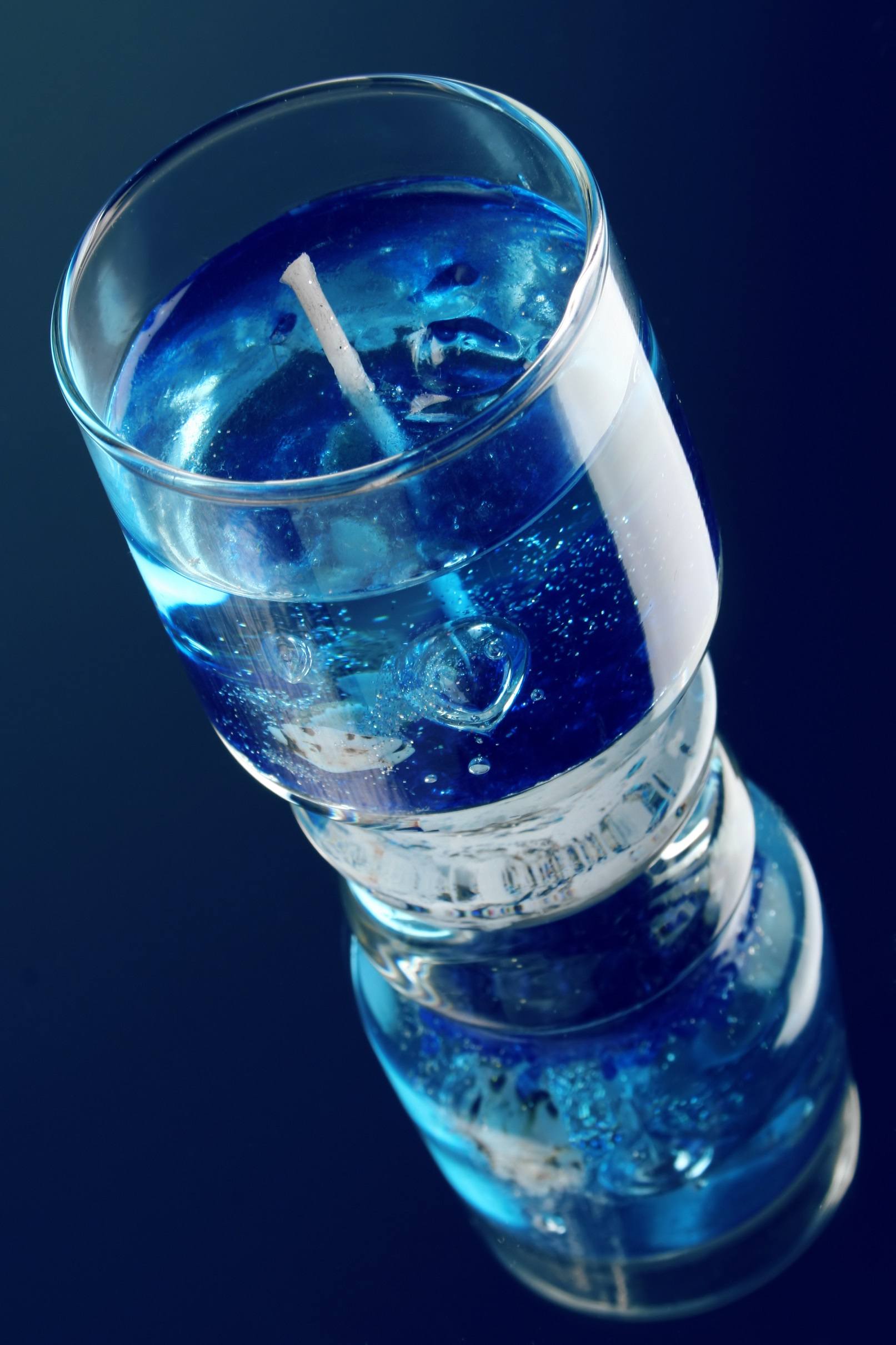 Gel candle on blue background