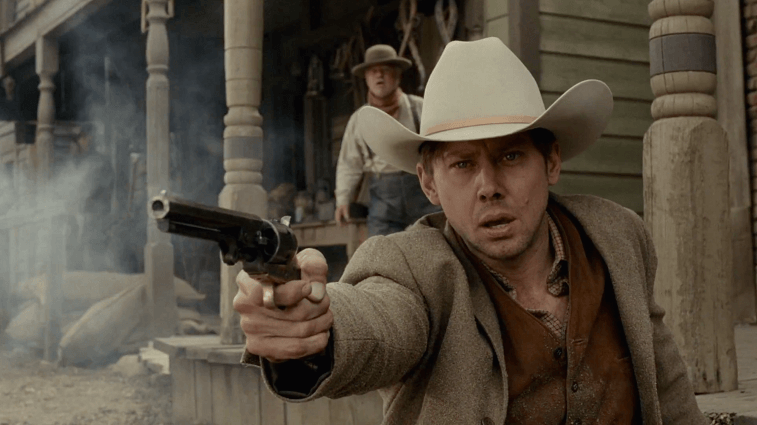 Jimmi Simpson as William firing a gun and wearing a cowboy hat in Westworld Jimmi Simpson as William firing a gun in Westworld
