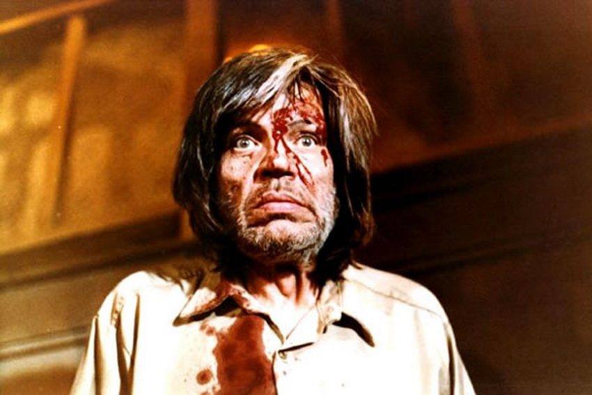 Neville Brand as Judd in Eaten Alive with blood on his face and shirt