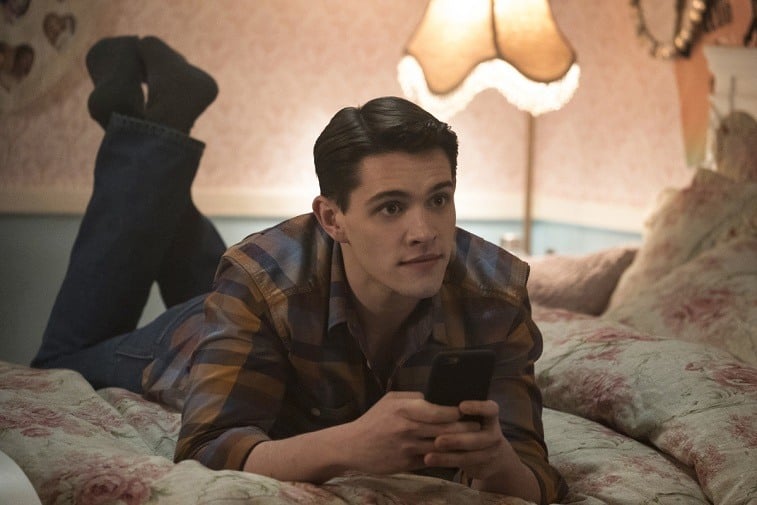 Casey Cott as Kevin Keller lays on a bed on Riverdale