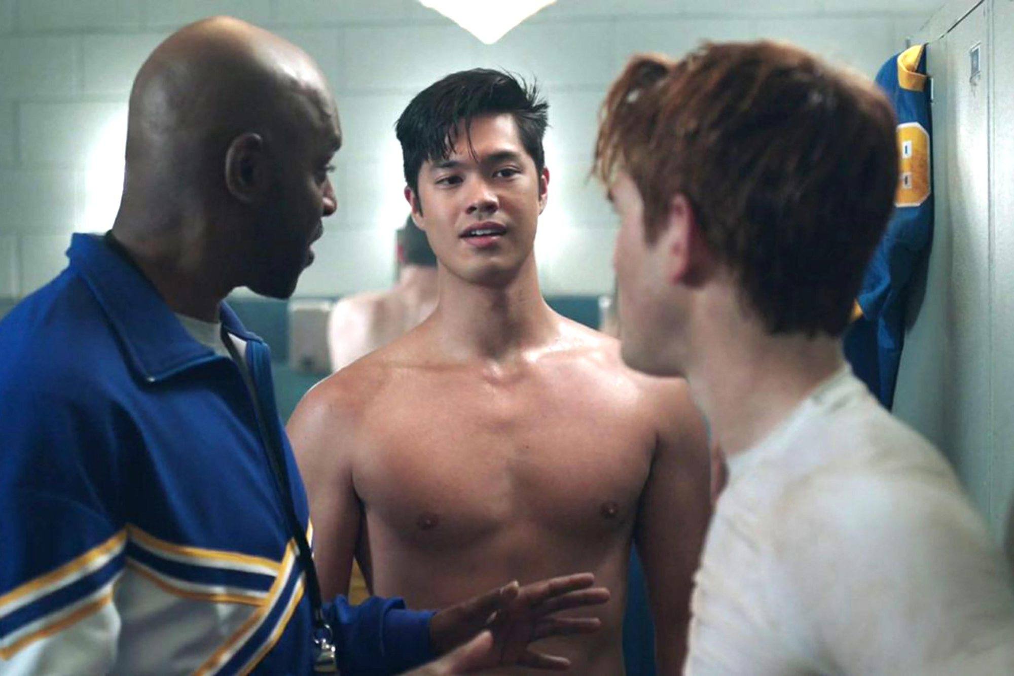 Ross Butler stands shirtless in between two men on Riverdale Ross Butler stands shirtless in between two men on Riverdale