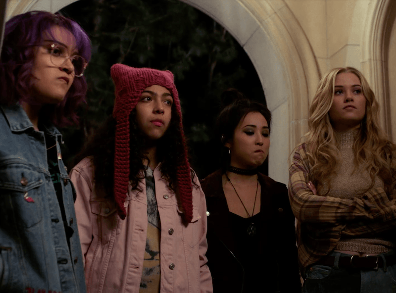 Four teens stand in line Four teens stand in line