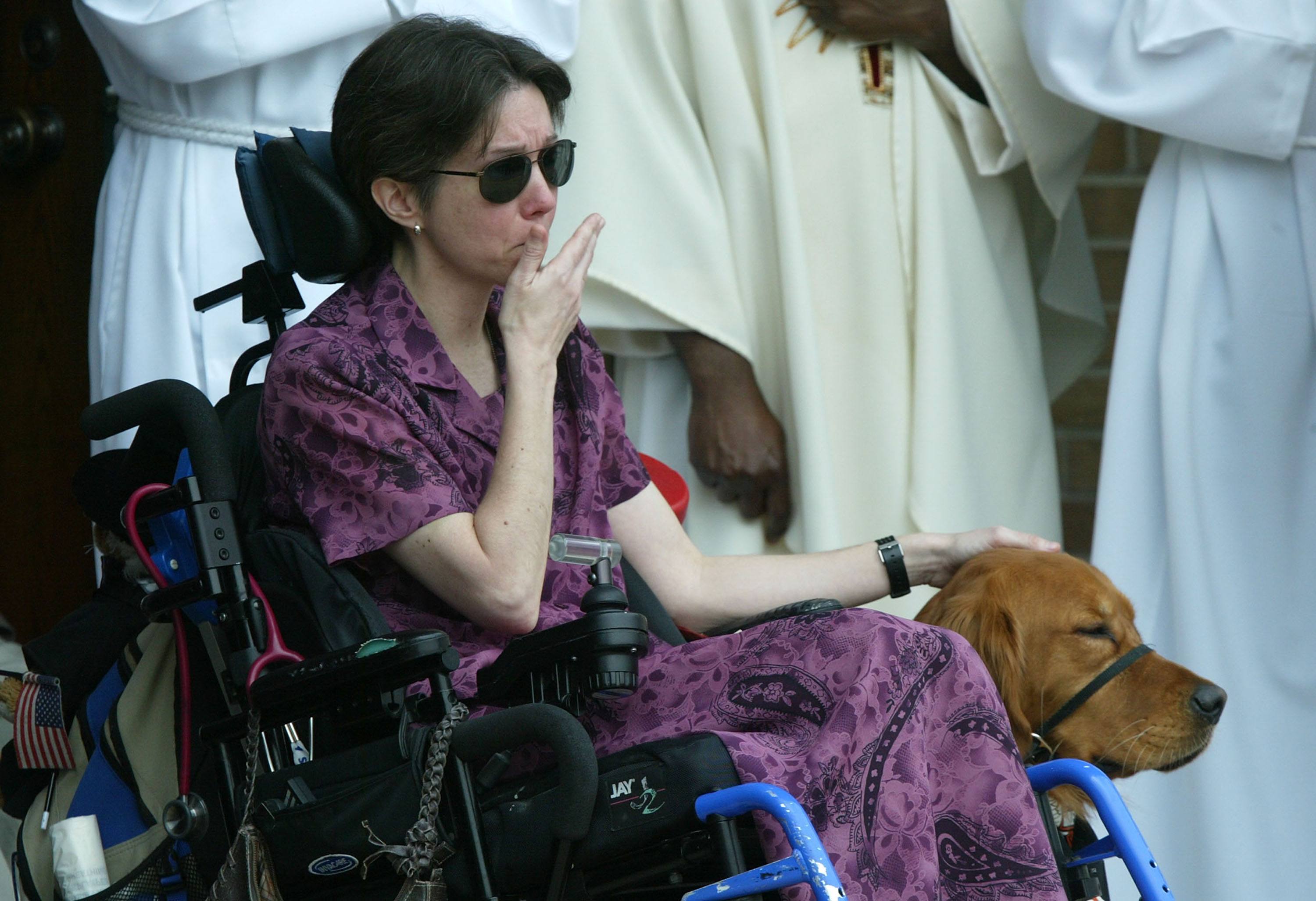 Woman in wheelchair with service dog