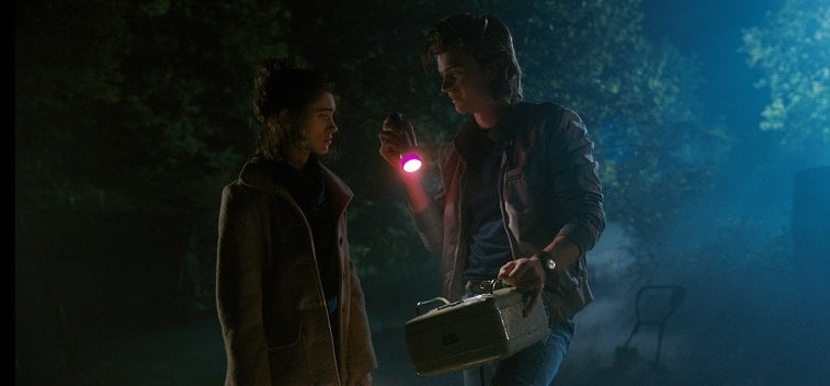 Nancy and Steve stand next to each other in a dark night in Stranger Things 2 Nancy and Steve stand next to each other in a dark night in Stranger Things 2
