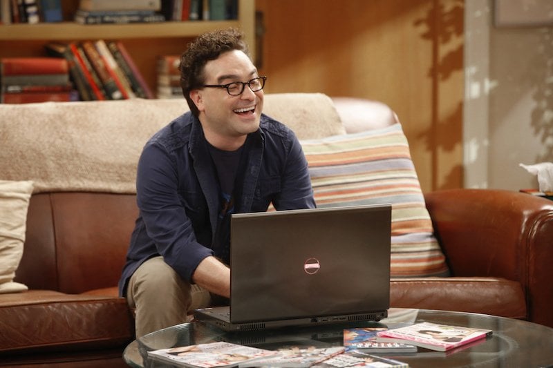 Leonard Hofstadter sits on a couch in front of a laptop