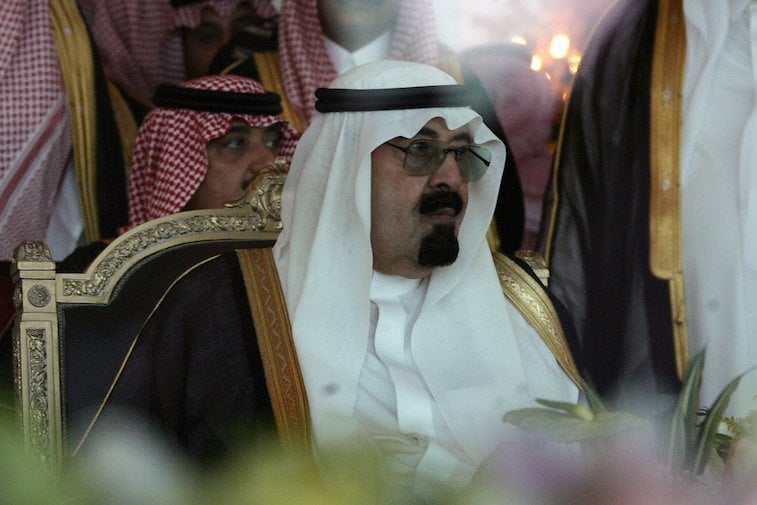 King Abdullah bin Abdul Aziz sitting on a black and gold throne. King Abdullah bin Abdul Aziz sitting on a black and gold throne.
