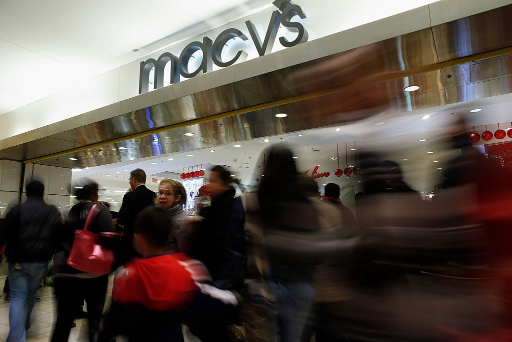 People enter to Macy's store at the Newport Mall