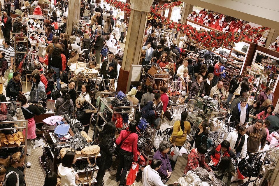 Shoppers crowd the floor at Macy's the day after Thanksgiving November