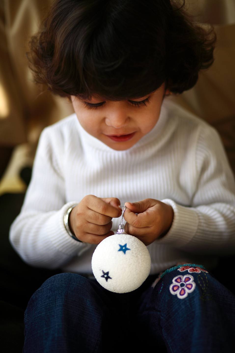 Girl holding a bauble