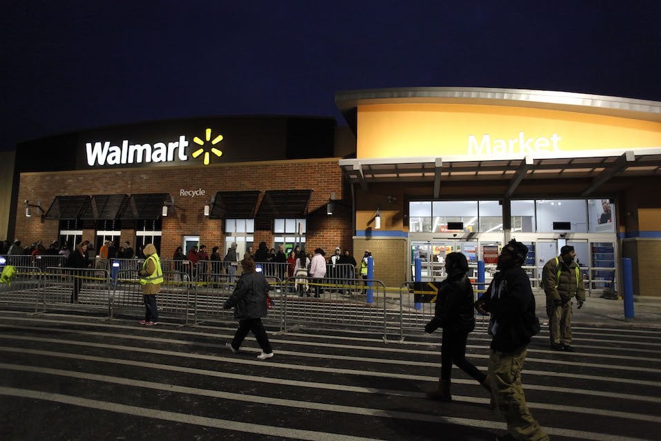 Customers wait in line to enter Wal-Mart Thanksgiving day