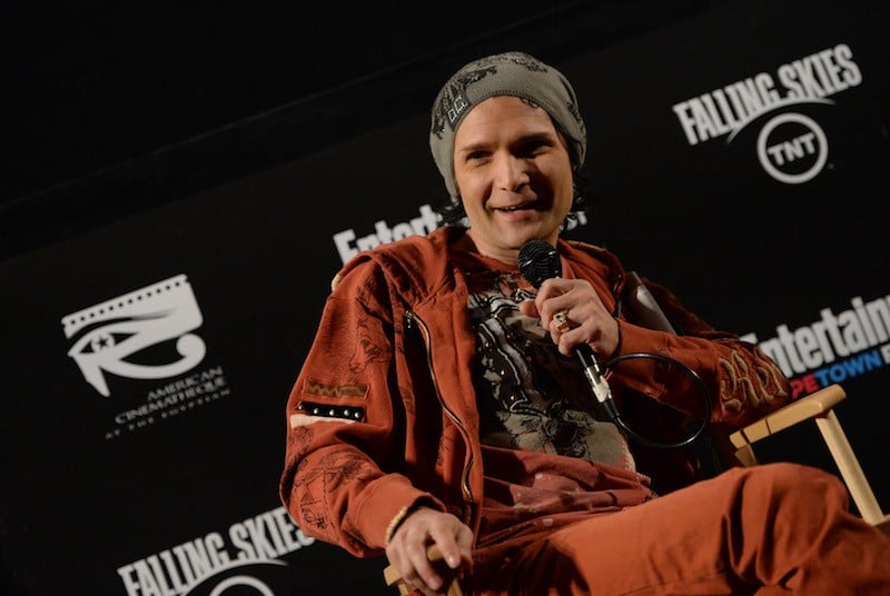 Corey Feldman holding a microphone. Corey Feldman holding a microphone.