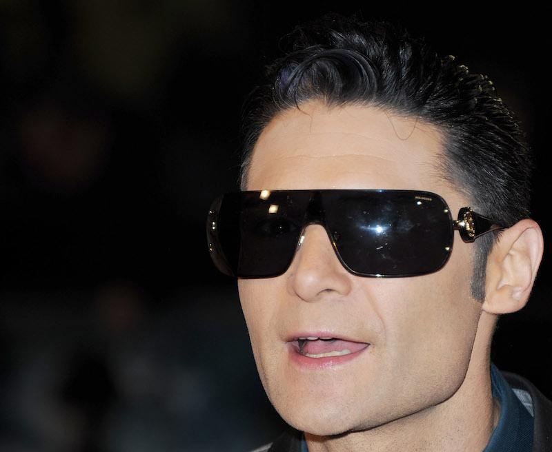 Corey Feldman attends a movie premiere while wearing dark sunglasses. Corey Feldman attends a movie premiere while wearing dark sunglasses.