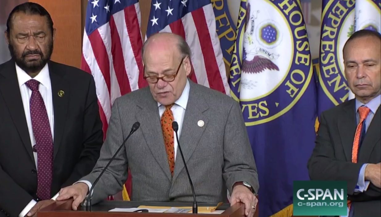 3 mmen in suits standing in front of the american flag and a flag of the house of representatives. 3 mmen in suits standing in front of the american flag and a flag of the house of representatives.