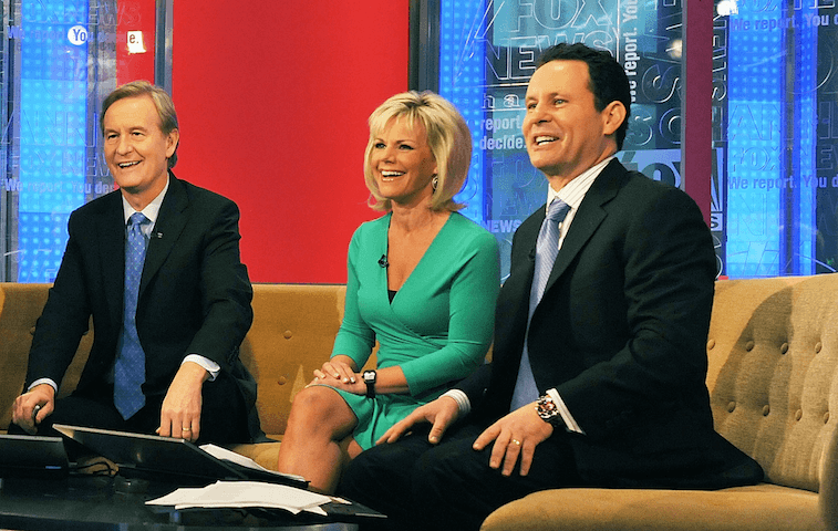 The Fox & Friends anchors sit on a brown couch. The Fox & Friends anchors sit on a brown couch.