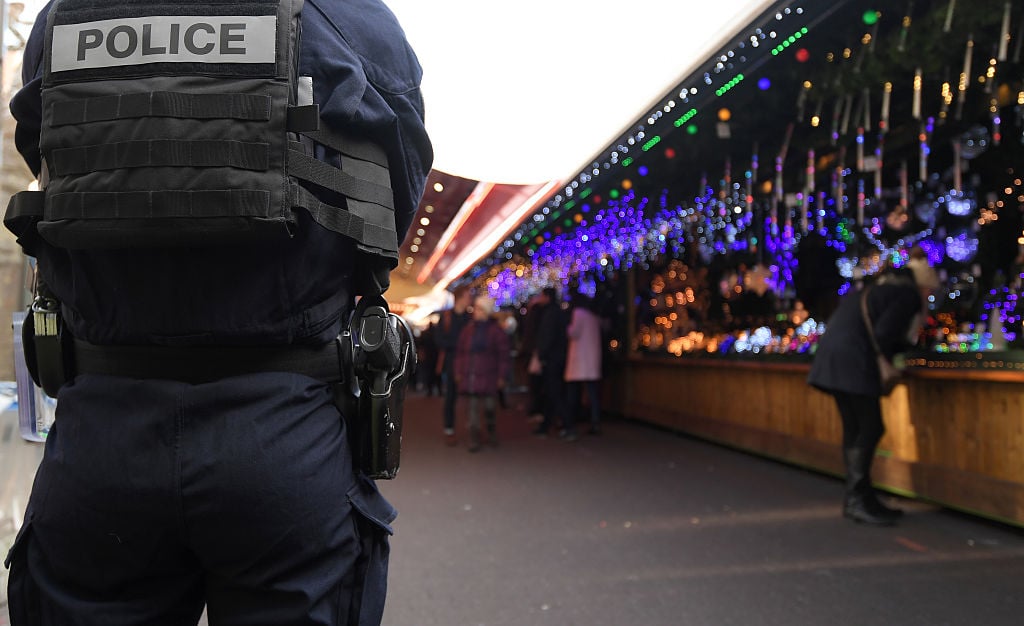 A police officer patrols on the Christmas market A police officer patrols on the Christmas market