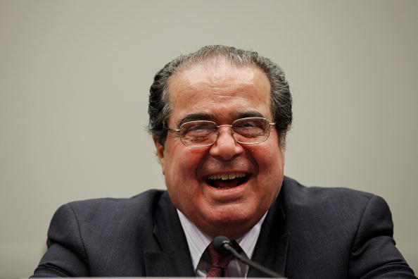 antonin scalia in black robes laughing antonin scalia in black robes laughing
