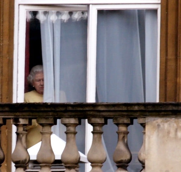 queen elizabeth peeks through a curtain at buckingham palace queen elizabeth peeks through a curtain at buckingham palace