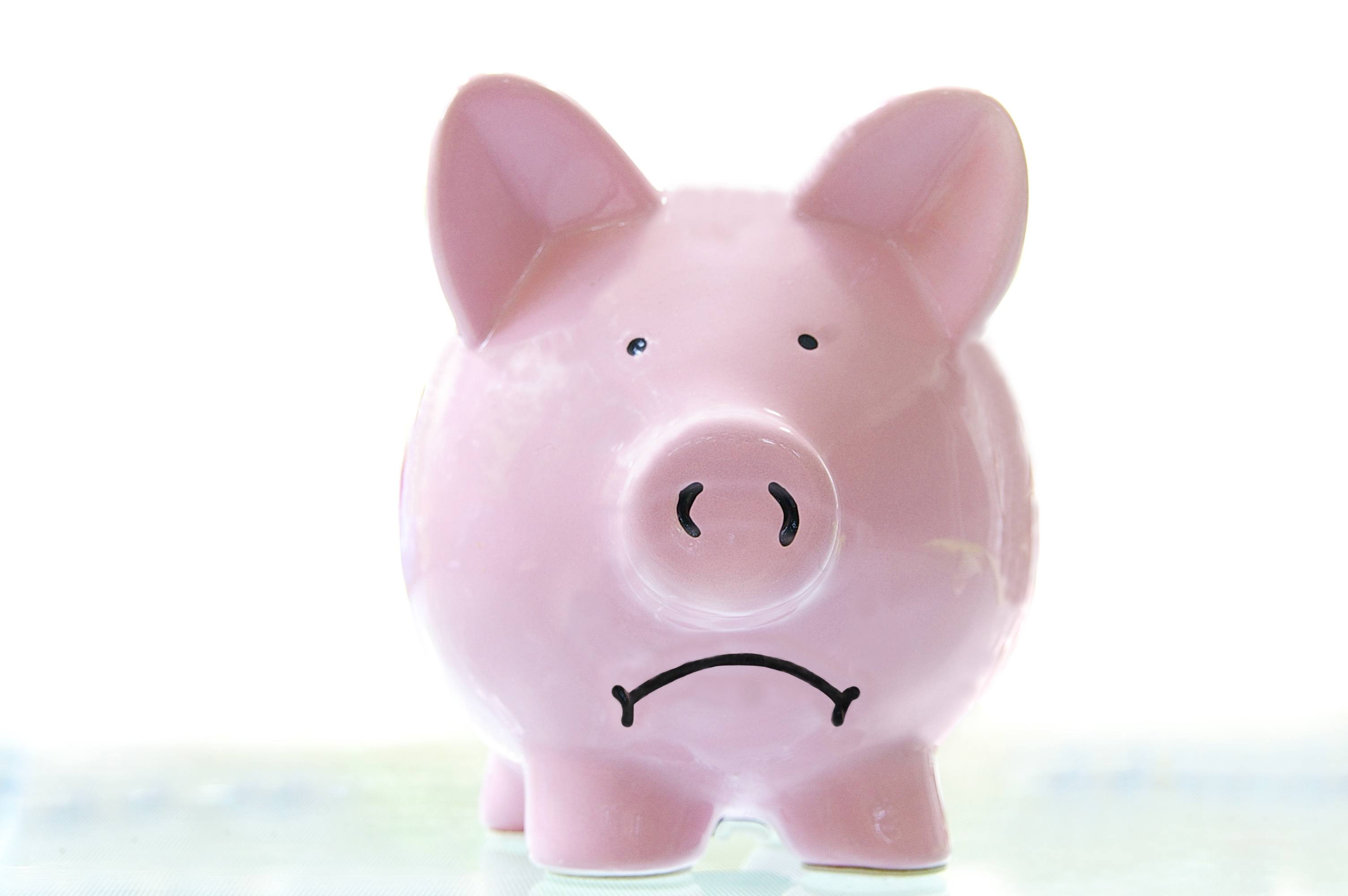 frowning piggy bank