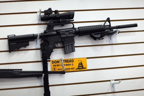 an AR-15 on the wall at a gun store