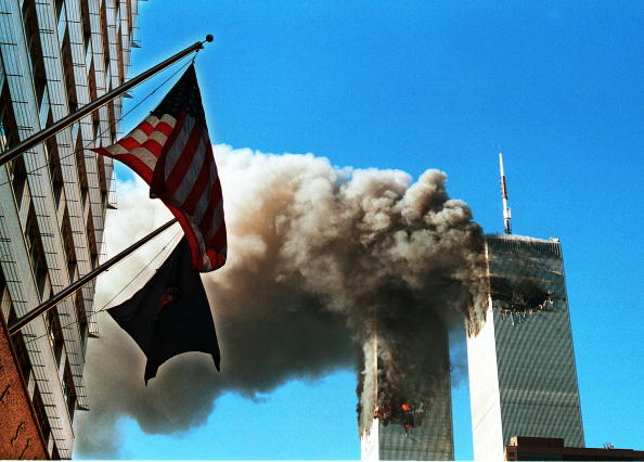 american flags flying in front of the world trade center on 9/11/01