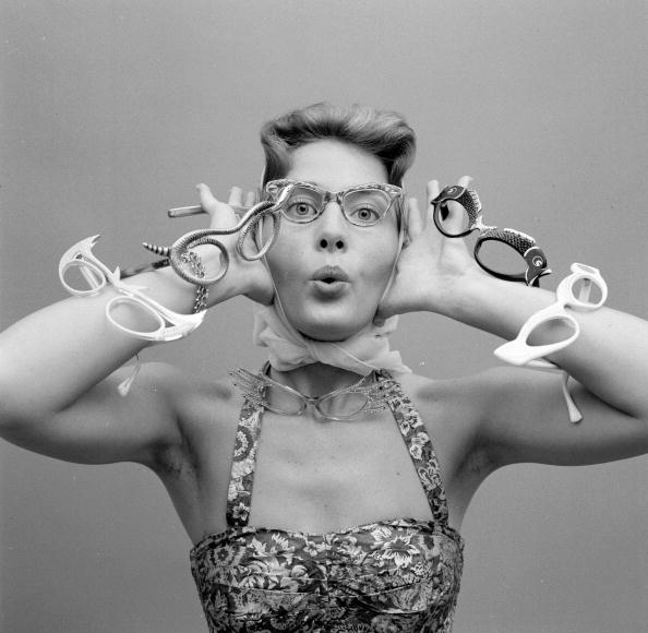 a 1960s model with eyeglasses a model with pairs of eye glasses