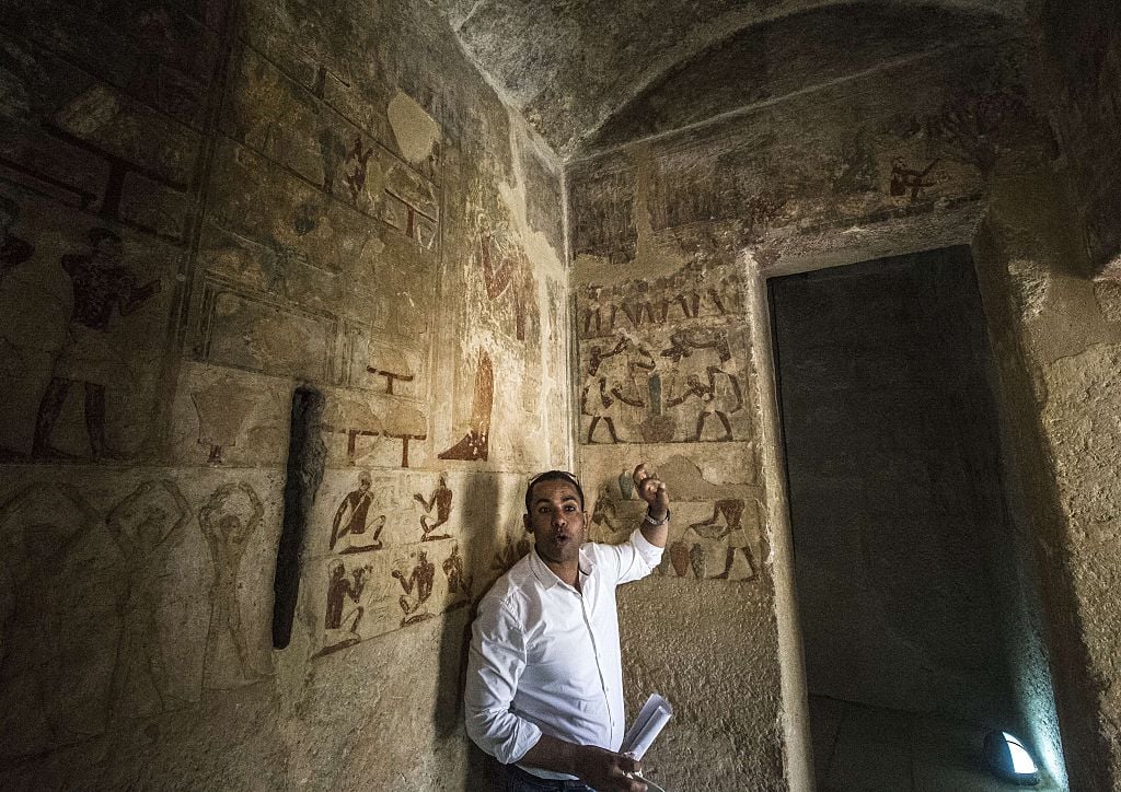 an Egyptologist inside one of the great pyramids