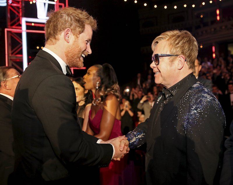Prince Harry greets Elton John after the Royal Variety Performance at the Albert Hall
