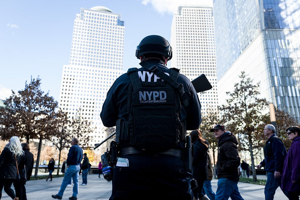 a new york city police officer at the 9/11 memorial a new york city police officer at the 9/11 memorial