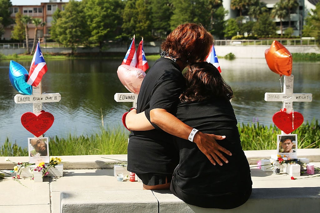 two women hung by the water and a Pulse shooting memorial two women hung by the water and a Pulse shooting memorial