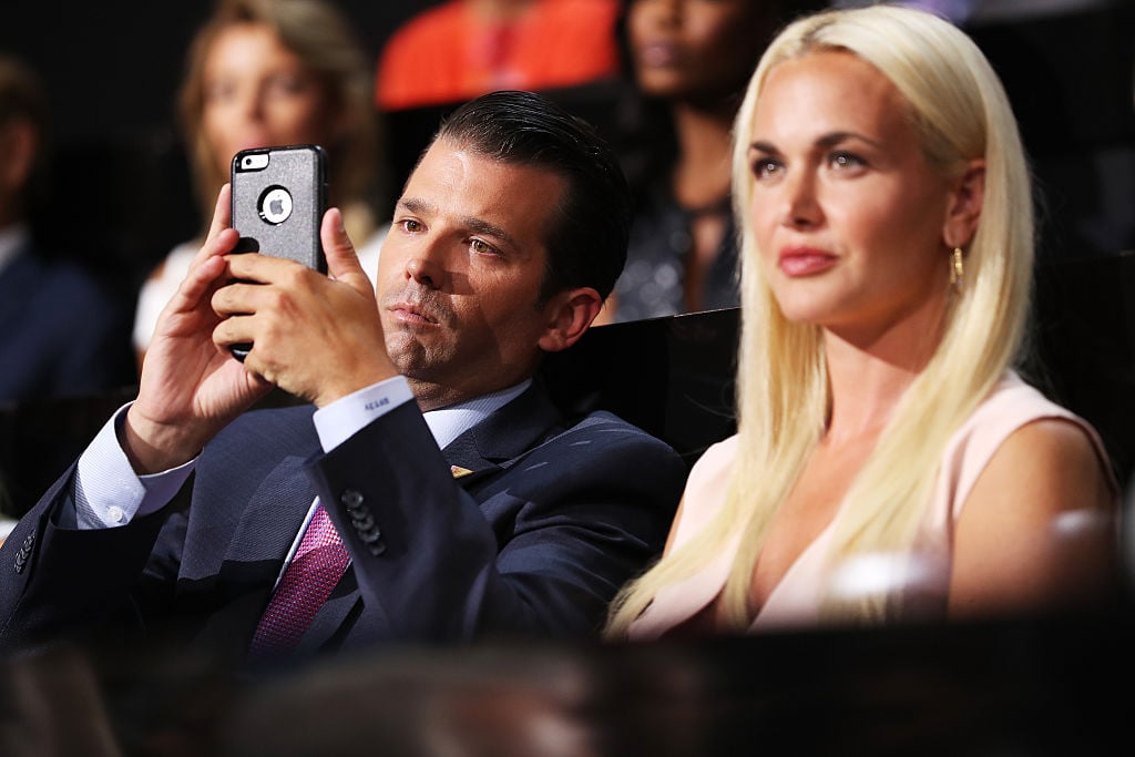 Donald Trump Jr in a crowd on his phone
