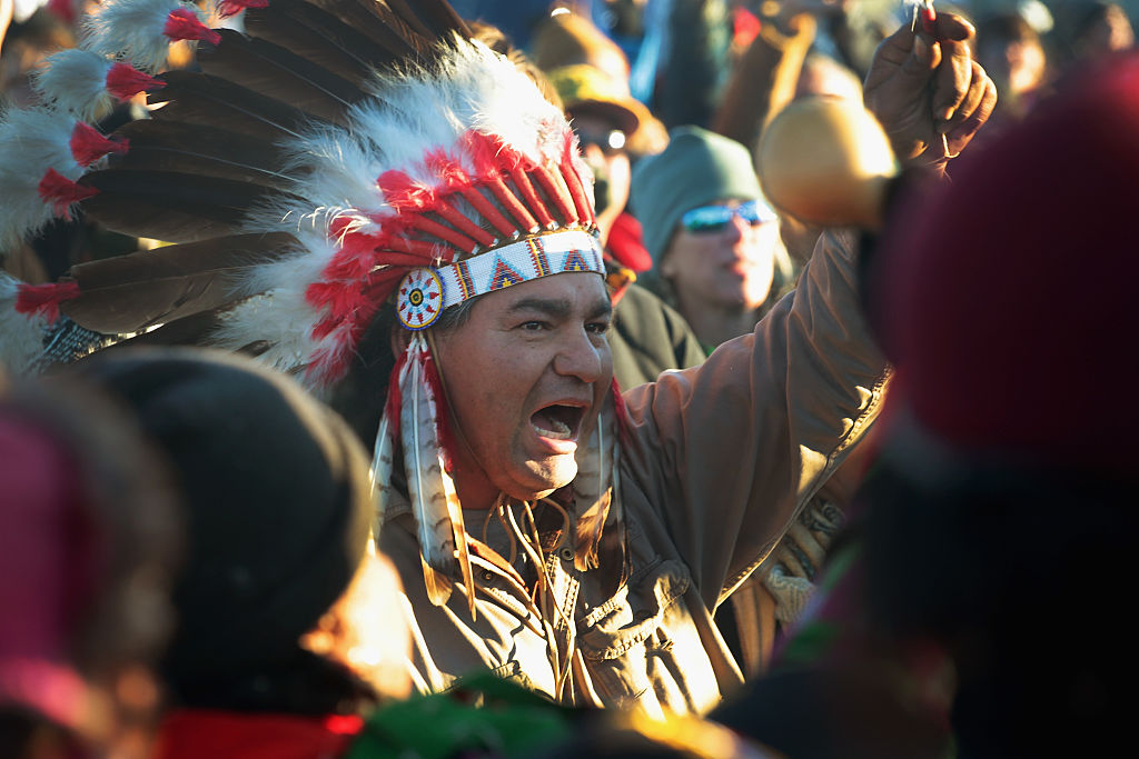 a native american chief yells at standing rock