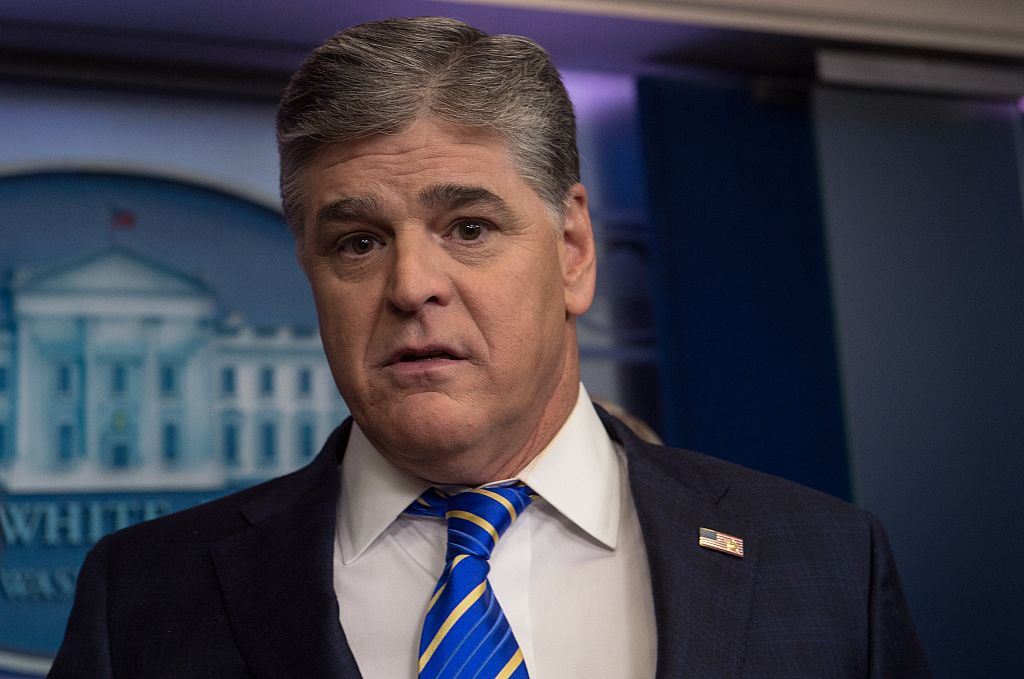 sean hannity in a white shirt and blue tie and dark jacket in the white house briefing room sean hannity in a white shirt and blue tie and dark jacket in the white house briefing room