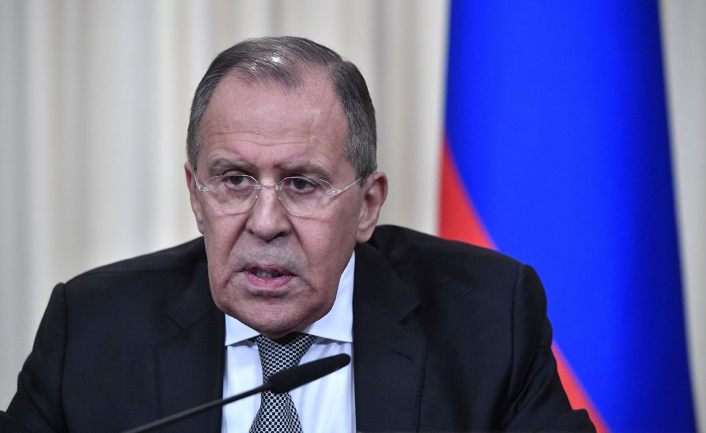 Russian Foreign Minister Sergei Lavrov in a black suit and grey tie.