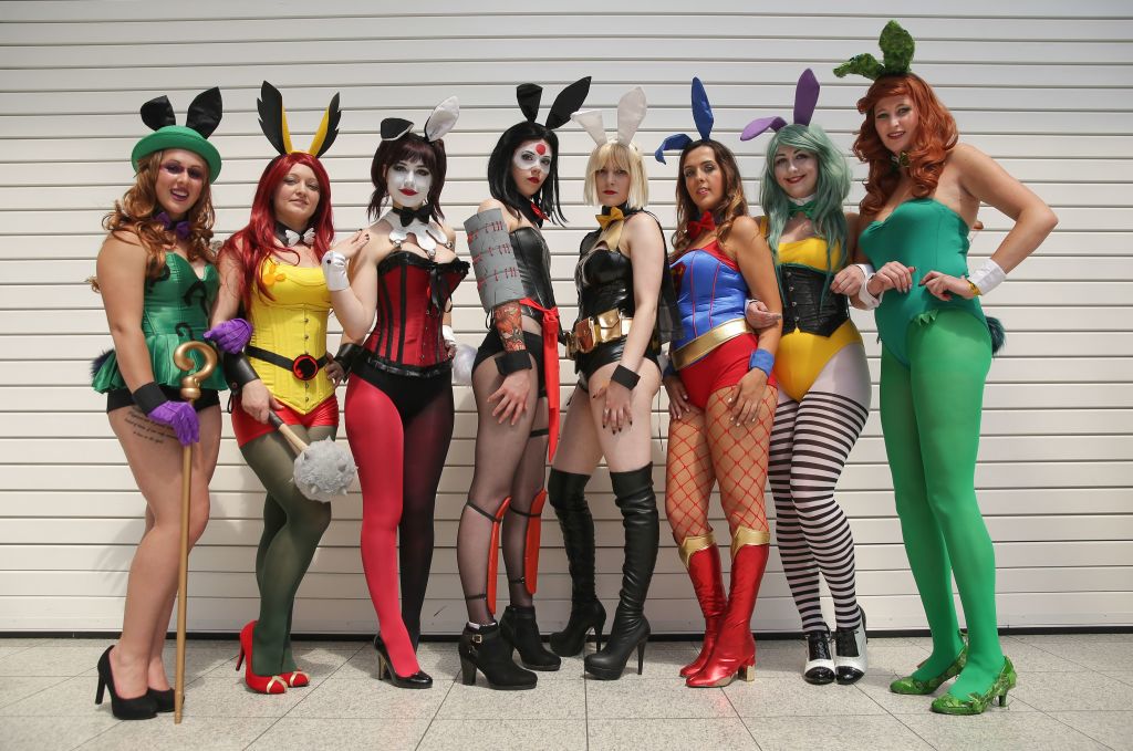 a group of women dressed as superheroes a group of women dressed as superheroes