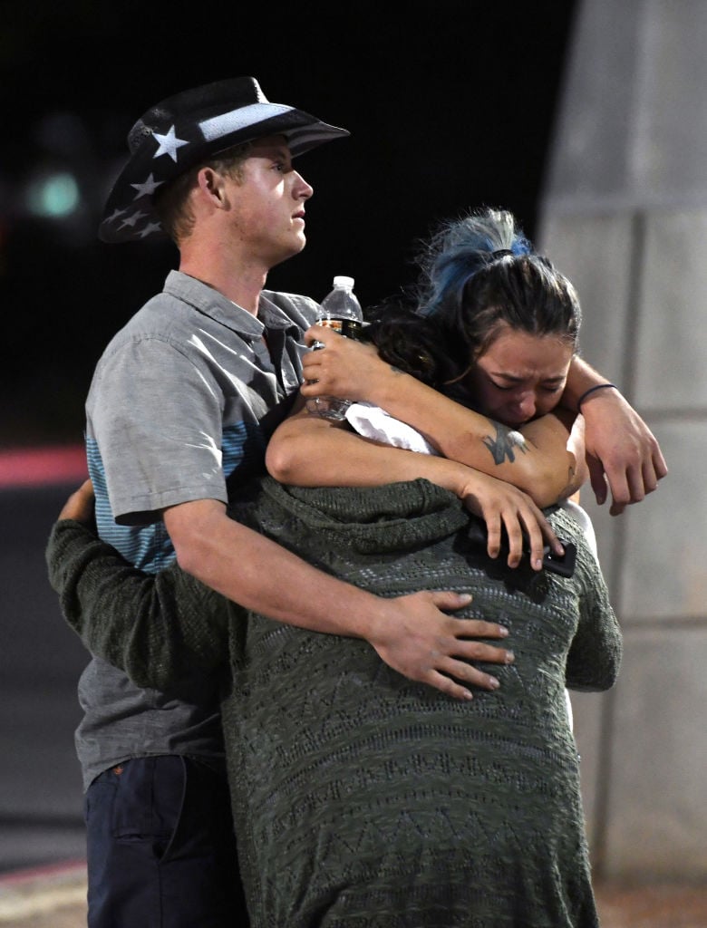 people hug with a police officer after las vegas shooting people hug with a police officer after las vegas shooting