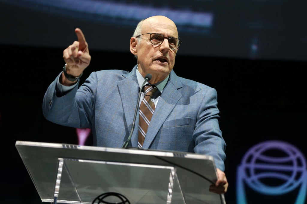 jeffrey tambor speaking at a podium in a light blue blazer jeffrey tambor speaking at a podium in a light blue blazer