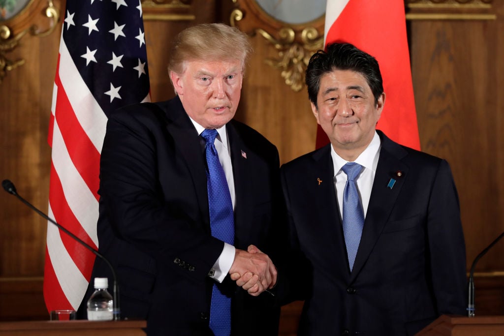 donald trump and shinzo abe in tokyo, both in dark suits and blue ties