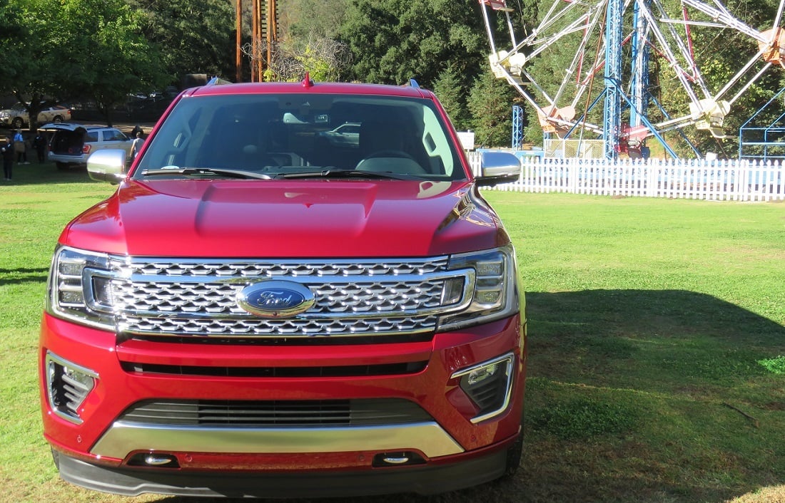 Front view of 2018 Ford Expedition Platinum with ferris wheel in background