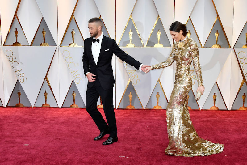 Jessica Biel and Justin Timberlake walking on a red carpet. Jessica Biel and Justin Timberlake walking on a red carpet.