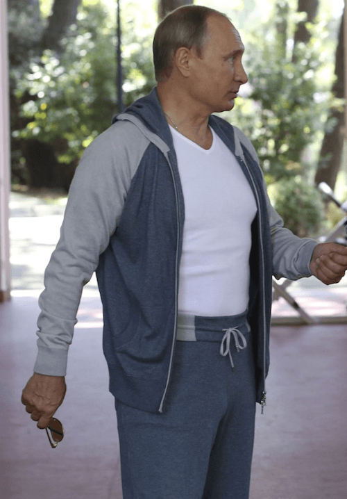 Putin walks while wearing a white and grey workout outfit. Putin walks while wearing a white and grey workout outfit.