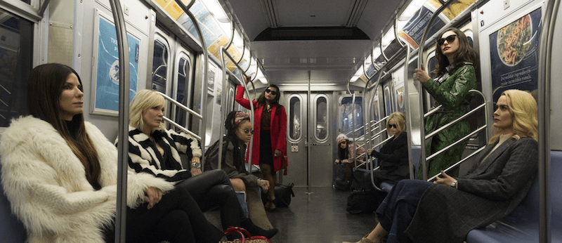 Women sitting on the subway.