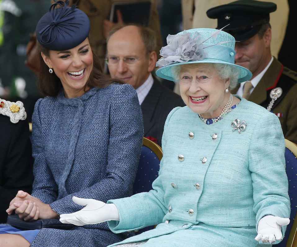 Queen Elizabeth and Kate Middleton laughing together.